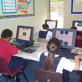 South Bay Christian Academy Photo #2 - Students working on computers in the Elementary classroom