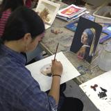 Ananda Living Wisdom School Photo #7 - A student in the high school art class working on the famous artwork project. The students research a famous artist, learn about their medium, and have to imitate one of their paintings as well as add one subtle difference.