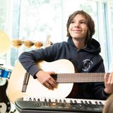 Berkeley Hall School Photo #16 - Students love working on different instruments in music class.