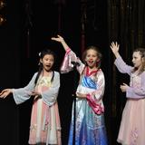 International School Of Indiana Photo #2 - A group of Grade 3 students performing at the Lunar New Year Celebration. This annual celebration allows ISI community members in the Mandarin language track to showcase and celebrate their culture.