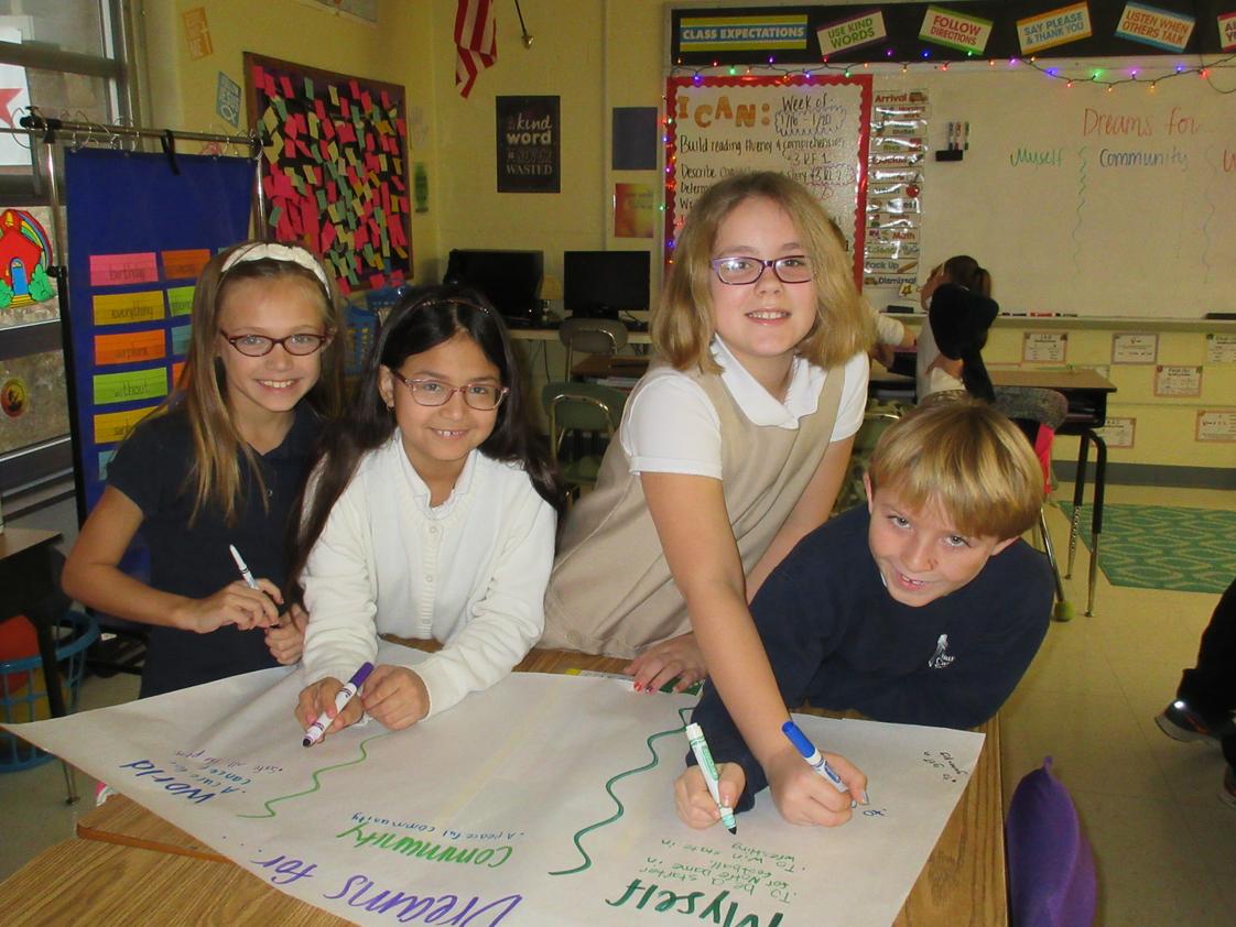 Nativity Catholic School Photo #1 - Third grade students work on writing dreams for themselves, their community, and the world