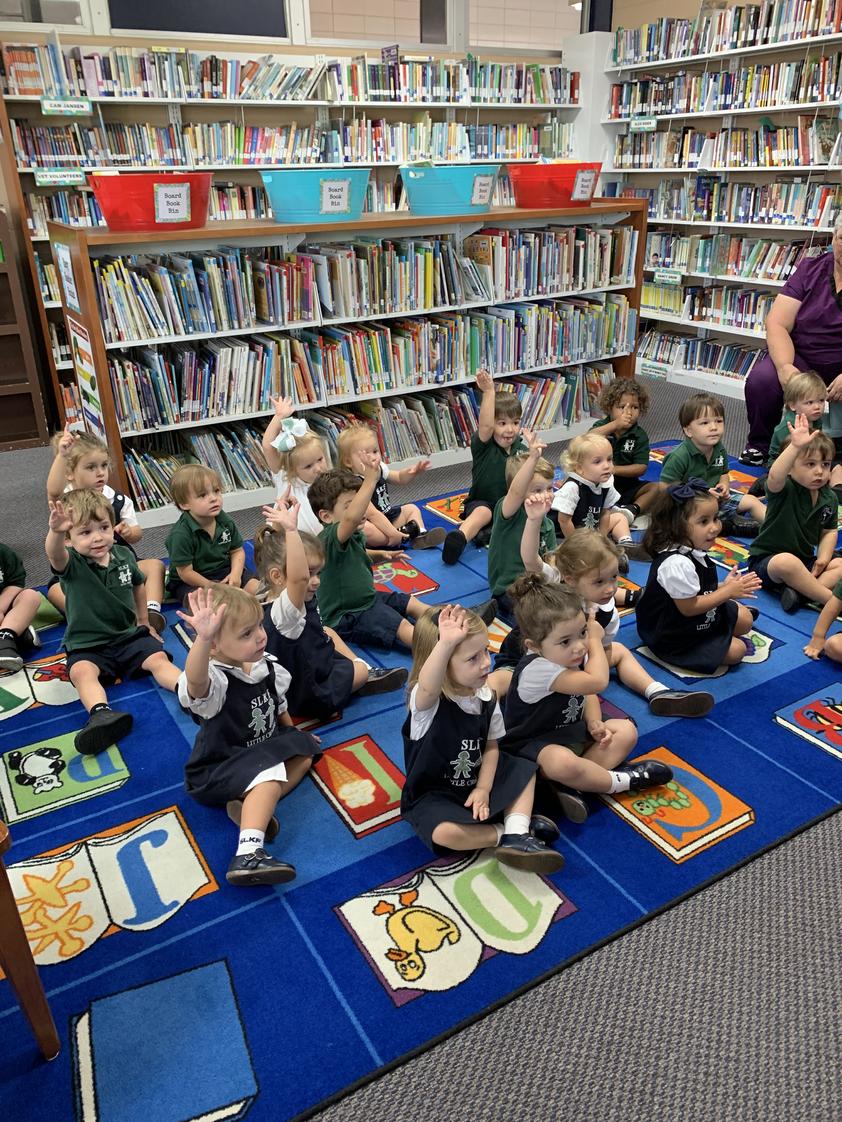 St. Louis King Of France School Photo #1 - PK2 students enjoy Library class and reading with friends.