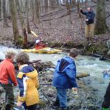 Riley School Photo #2 - Lower school children take turns trying kayaking in the stream on Riley Campus under the watchful eye of the Lower school teacher.