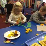 Creative Garden Nursery School & Kindergarten Photo #6 - Learning to use scissors.