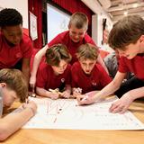 Catholic Memorial Photo - Middle schoolers work together during their start of school retreat.