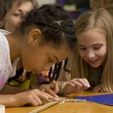 Greenfield Center School Photo #7 - Two 4th grade students work on measurement together in math. The Center School recognizes that there are many different learning styles represented in a classroom of children. The teachers are experts at helping each child develop their best strengths & challenges through multi-modal approaches.