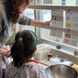 King's Wood Montessori School Photo #3 - Hands-on learning in action: students follow step-by-step instructions to bake their own artisan bread, bringing home not just a delicious treat, but a sense of accomplishment