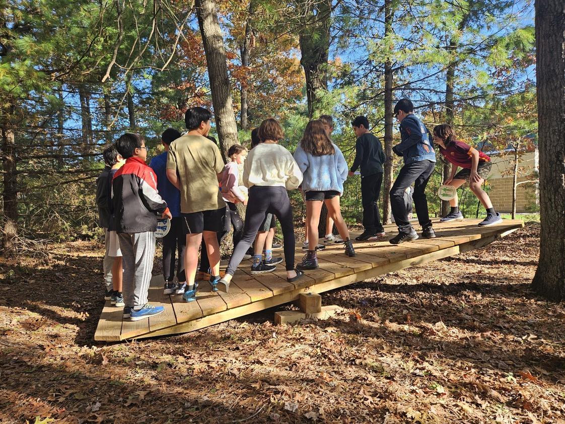 The Sage School Photo #1 - Upper School Students explore collaboration and communication on our Morahan Low Elements Course.