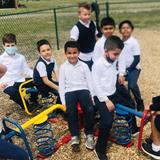 Oakland Childrens Academy Photo #10 - Elementary students enjoying recess on a warm, spring day!