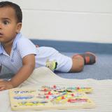 St. John The Baptist Catholic Montessori School Photo #8 - A toddler working with a puzzle