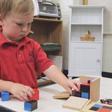 St. John The Baptist Catholic Montessori School Photo #6 - The binomial cube teaches spatial awareness to preschoolers and then how to square numbers with elementary students