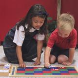 St. John The Baptist Catholic Montessori School Photo #5 - Working with the multiplication board