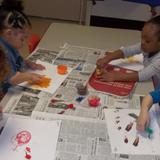 Voorhees KinderCare Photo #10 - Developing our fine motor skills while creating star portraits using chalk.