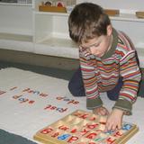 New World Montessori School Photo #4 - Once children know the sounds of the letters, the next step is learning to spell words.