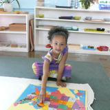 New World Montessori School Photo #3 - Learning geography with puzzle maps is a favorite activity for many of the children.