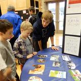 Princeton Montessori School Photo #3 - A Middle School student explains his science experiment at the annual Science Fair.