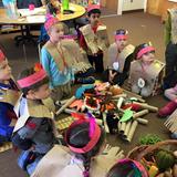 Young World Day School Photo #10 - Young World students experience many cultural traditions in the classroom. Here they are exploring an Indian gathering at "campfire".
