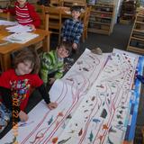Fields Of Green Montessori School Photo #2 - Students Working on the Timeline of Life