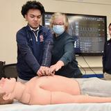 Archbishop Stepinac High School Photo #9 - Hands on career learning with adjunct professors from medical professions (adult patient human simulator)