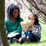 Blue Rock School Photo #6 - Teacher spending time reading one-on-one with student outside. Smaller class sizes allow for more personal attention.