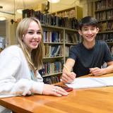 Professional Children's School Photo - Students collaborating in the PCS library.