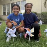 Echo Horizon School Photo #7 - A joyful friendship moment as we celebrate Pinwheels for Peace.