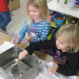 Glastonbury KinderCare Photo #7 - Preschoolers comparing volume; which holds more?