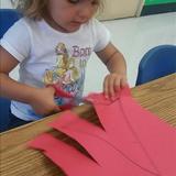Mission Grove KinderCare Photo #9 - Discovery Preschool is full of new discoveries! Practicing scissor safety and learning to cut is all apart of a two year olds development.