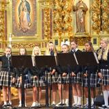 Mission Basilica School Photo #7 - The 8th grade cantors sing at weekly Mass.