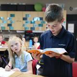 Carmel Christian School Photo #22 - Reading God's Word during Bible class creates a firm biblical foundation for students.