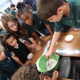 Immaculata Catholic School Photo #6 - Learning is hands-on and active at Immaculata. Here Grade 1 and Grade 5 buddies have gotten together to do an experiment together.