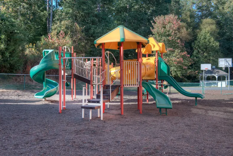 Hill Learning Center Photo #2 - Students at Hill enjoy the playground and basketball court during recess.