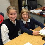New Hope Christian Academy Photo - 6th Grade collaborative reading with 3rd Grade.