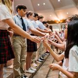 St. Elizabeth Ann Seton Photo #8 - 8th graders passing on the light of leadership to the 7th graders the week before they graduate and move on to high school.