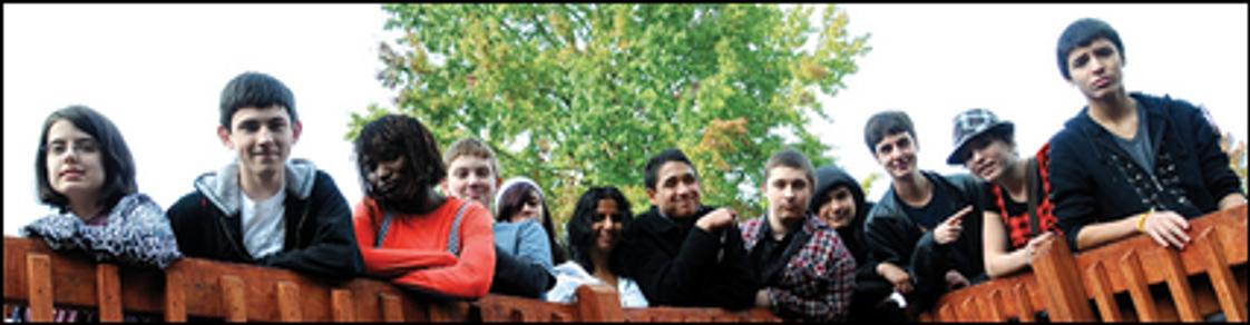 Park Academy Photo #1 - A group of upper school students pose for a photo on the deck outside their classrooms.