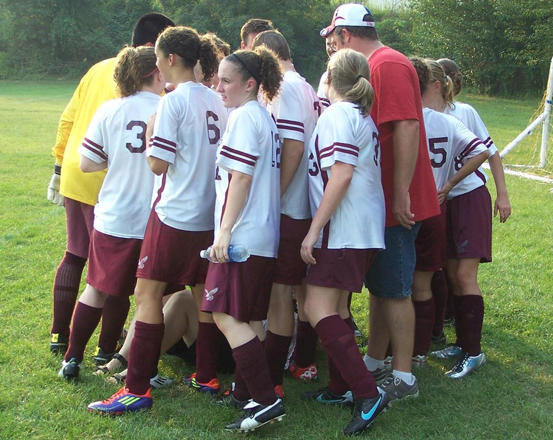 Champion Christian School Photo #1 - Soccer team huddle