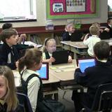 St. Thomas More School Photo #2 - 2nd Grade using iPads.