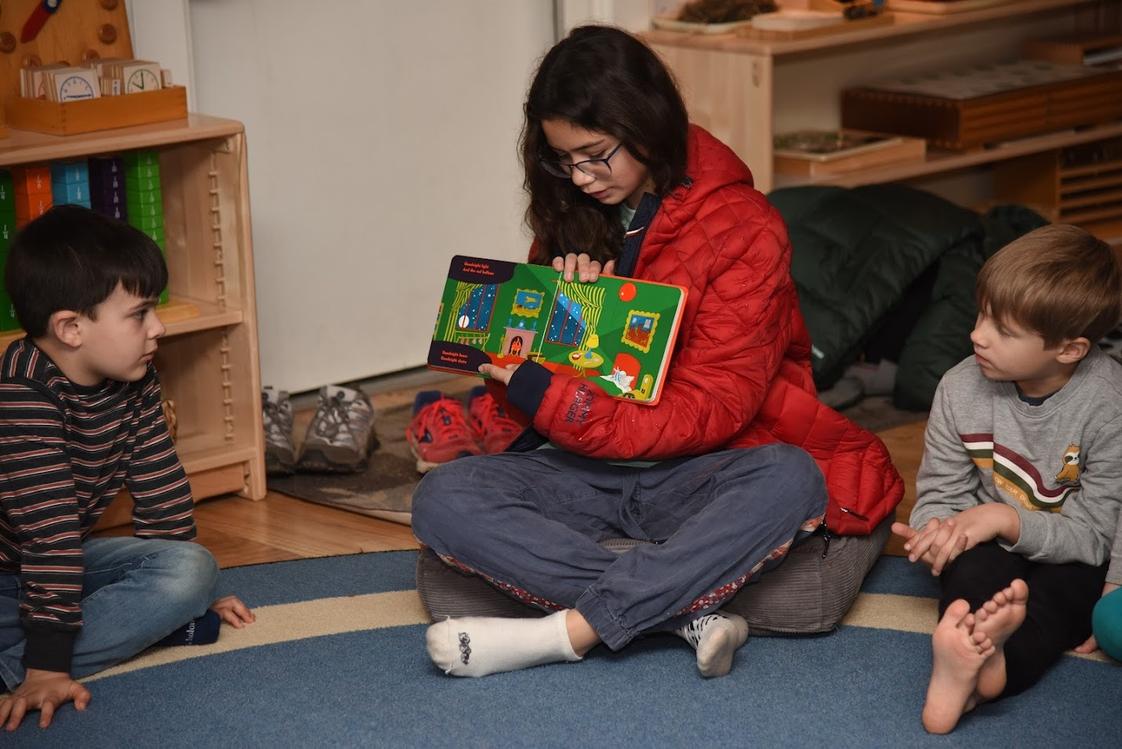 Montessori School Of Columbia Photo - Upper Elementary guest reading to Primary level students