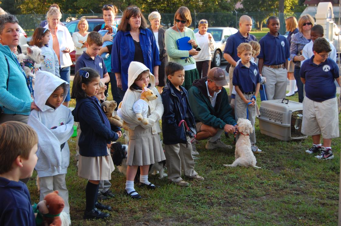 St. John Catholic School Photo - SJCS students and families gather with their pets (or stuffed animals) for our annual blessing of the pets.