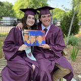 Davidson Academy Photo - Class of 22 classmates holding their DA preschool graduation photo.