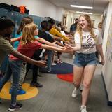 Lausanne Collegiate School Photo #9 - To celebrate the success of the senior class, the PK - 11th grade students at Lausanne Collegiate School line the hallways for the seniors college t-shirt walk. Each graduating class has a 100% acceptance rate to 4-year accredited colleges and universities. Empowered for their own individual journeys, students attend a wide variety of schools.