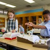 Overbrook Catholic School Photo #3 - Second graders preparing for their First Communion by learning the prayers of the Mass with their handmade clay Mass kits.