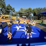 Jack Segal Academy (formerly BYDS) Photo #1 - Segal Students playing on the new Rhona & Bruce Caress Playground and Sports Center