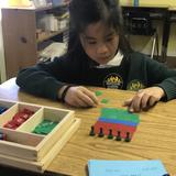 Montessori Learning Institute Photo #4 - Elementary student with division work