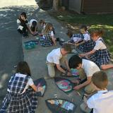 Grace Lutheran School Photo #4 - Students draw their stained glass artwork outside on a balmy fall day. Fine arts are heavily emphasized classwork at Grace, students compete in state sponsored art shows and present their works in our annual Grace Lutheran Open House Art Exhibitions.