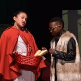 Browne Academy Photo #4 - Red Riding Hood and The Wolf interact during a scene from the middle school musical "Into the Woods Jr."