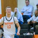 Hargrave Military Academy Photo #4 - A Hargrave varsity basketball player driving up court in front of a home crowd