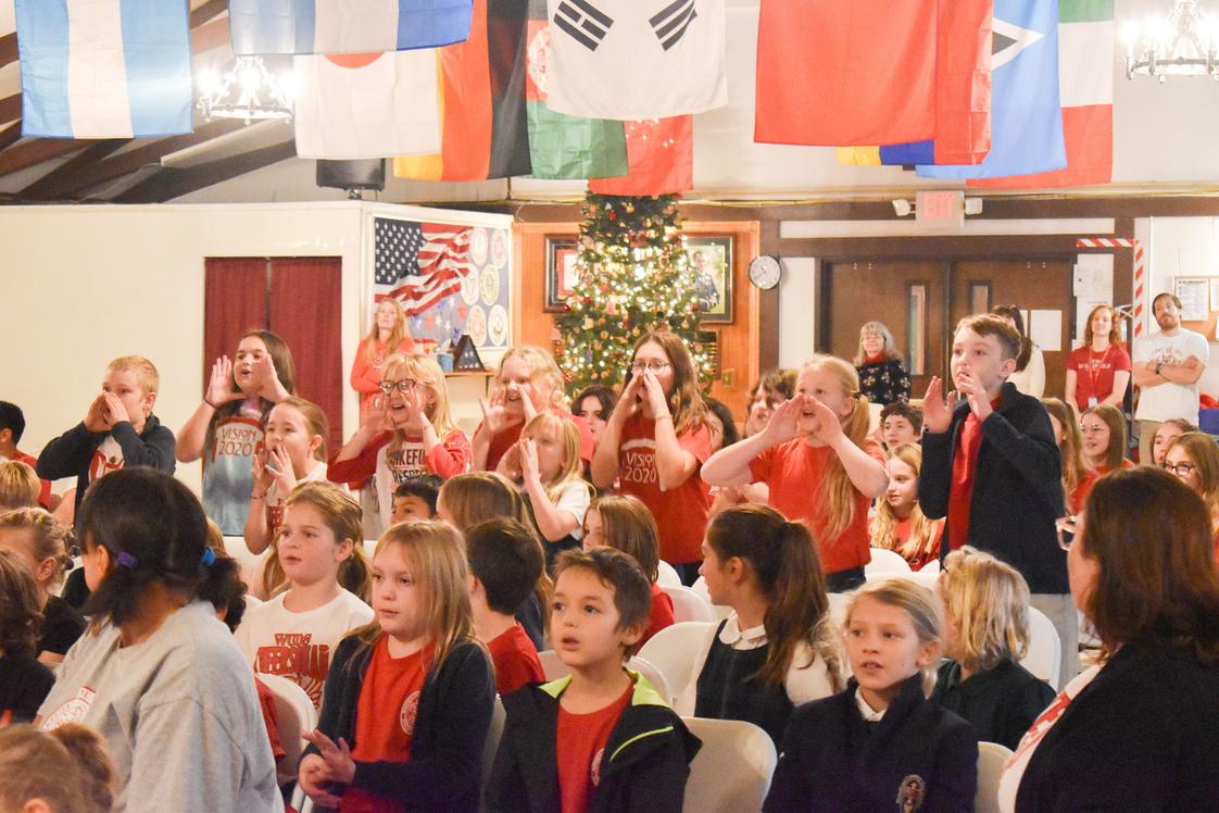 Wakefield County Day School Photo #1 - WCDS's 50+ year history blends academic excellence with time-honored traditions. Seen here, the Lower School grades do their part in singing the Twelve Days of Christmas one of several beloved Assembly traditions among the Lord of the Dance, Planets of the Sun, Alligator Stomp, and more.