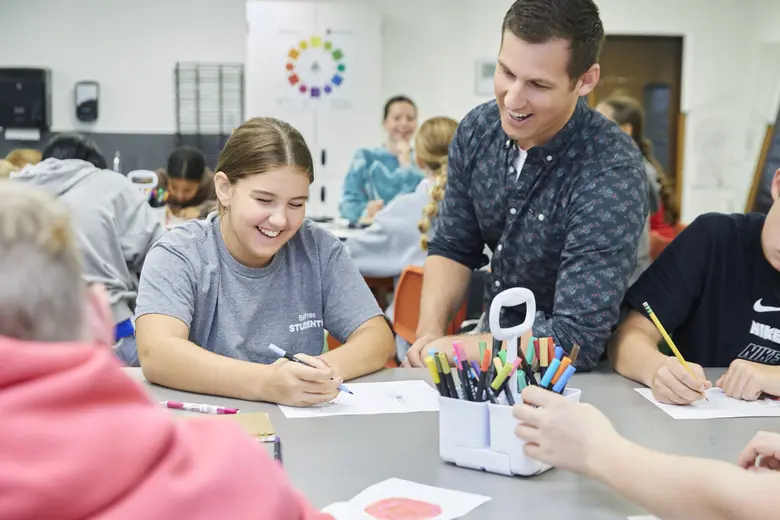 Bellevue Christian School – Clyde Hill Campus Photo - Students in art class learning wisdom from Mr. Sonheim, an art teacher at BCS