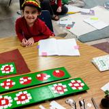 Cascadia School Photo #1 - Using the beautiful Montessori math materials to learn fractions.